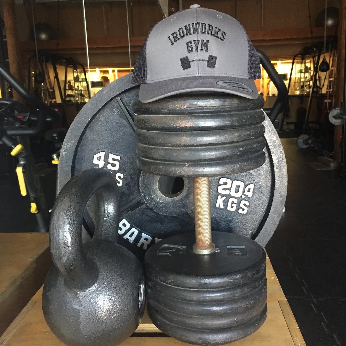 Plates, bars, and Iron Works Gym hat
